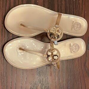 Tory Burch Rose Gold jelly thong sandals with rose gold medallion
